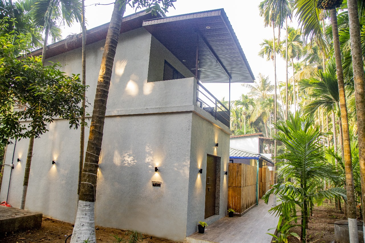 Modern multi-storey villa exterior & coconut grove